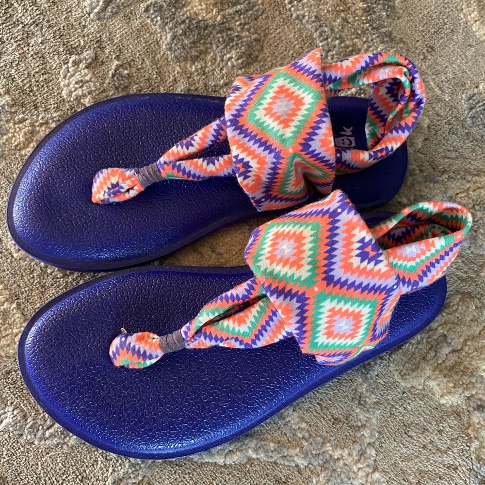 Kids Sanuk sandals.